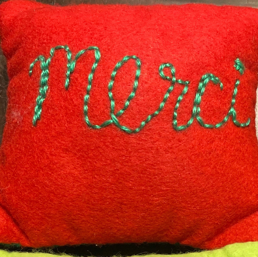 Felt merci pillow